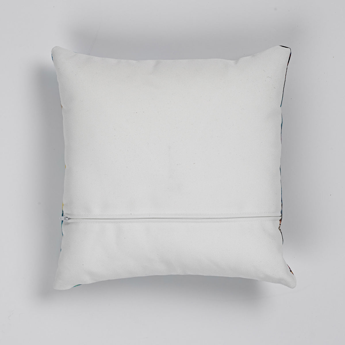 showing white reverse of linen cushion